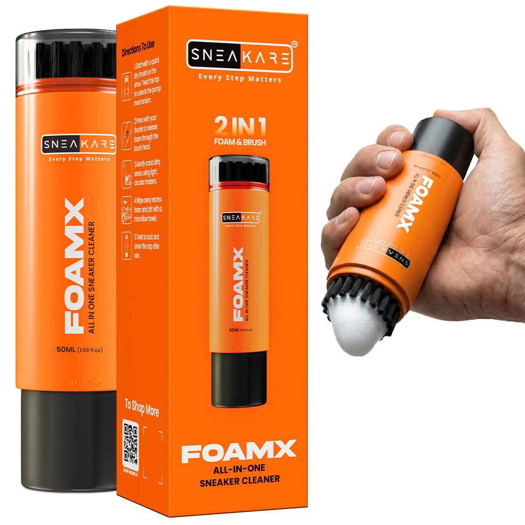 Sneakare Foamx all-in-one sneaker cleaner shown with its orange and black retail box, plus a hand holding the cleaner to demonstrate the brush attachment. The product is orange with black accents and white text.
